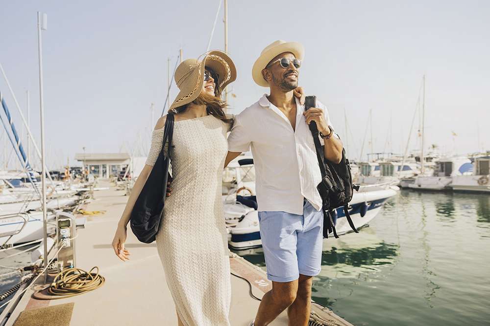 Couple enjoying a sunny day at the marina
